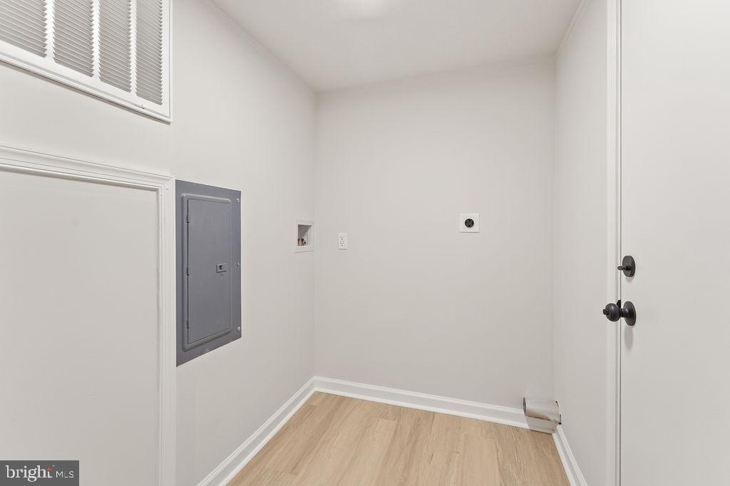 10022 Kentucky Springs Road Mineral, VA 23117 - Photo 16 of 31 a view of a room with wooden floor and cabinet