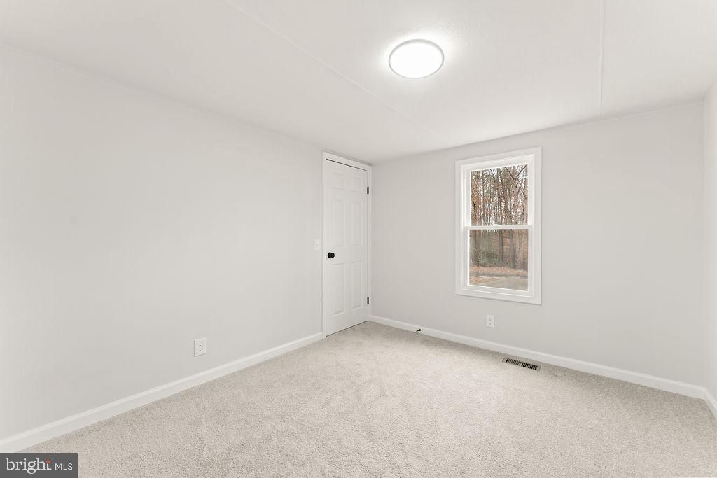 10022 Kentucky Springs Road Mineral, VA 23117 - Photo 17 of 31 an empty room with a window