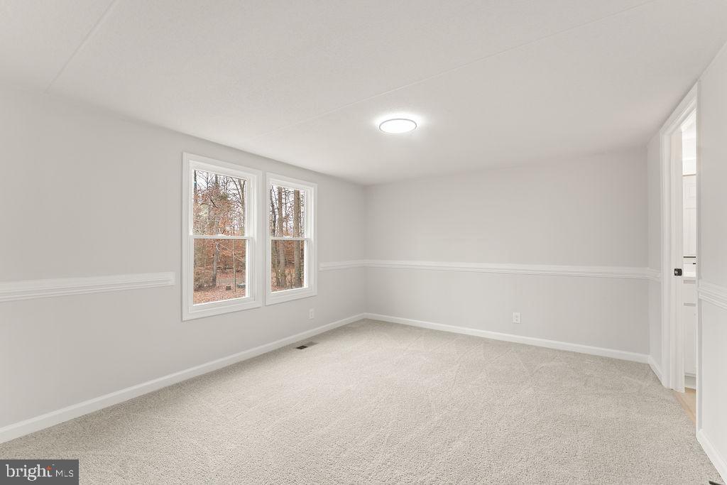 10022 Kentucky Springs Road Mineral, VA 23117 - Photo 6 of 31 an empty room with a window