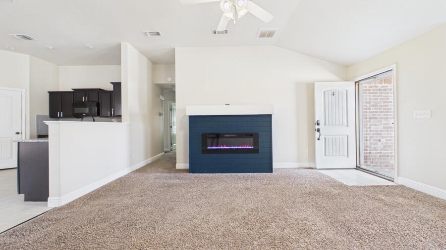 3707 Rochester Avenue Lubbock, TX 79407 - Photo 11 of 40 a big room with closet and a fireplace