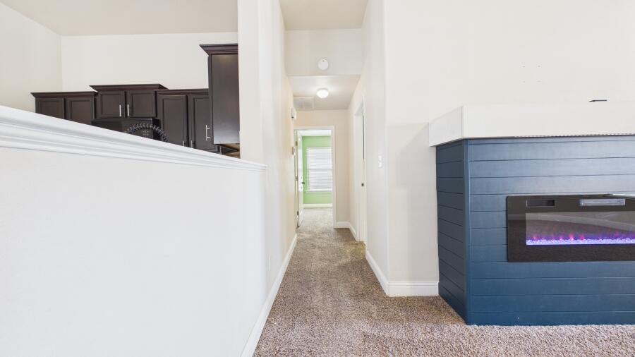 3707 Rochester Avenue Lubbock, TX 79407 - Photo 13 of 40 a view of a hallway with wooden floor and staircase