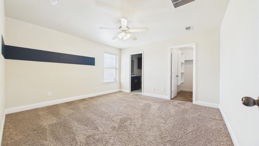 3707 Rochester Avenue Lubbock, TX 79407 - Photo 19 of 40 a view of an empty room with a ceiling fan