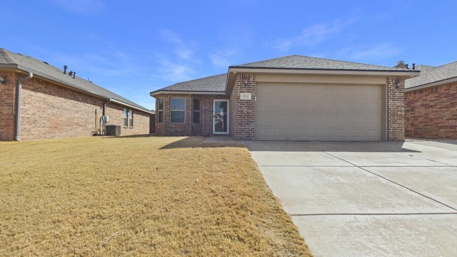 3707 Rochester Avenue Lubbock, TX 79407 - Photo 2 of 40 a front view of a house with a outdoor space