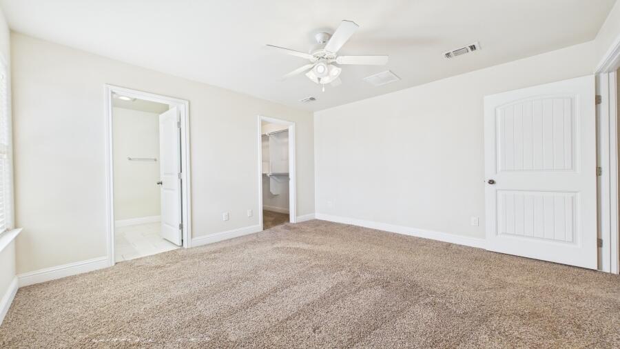3707 Rochester Avenue Lubbock, TX 79407 - Photo 22 of 40 a view of an empty room with a ceiling fan