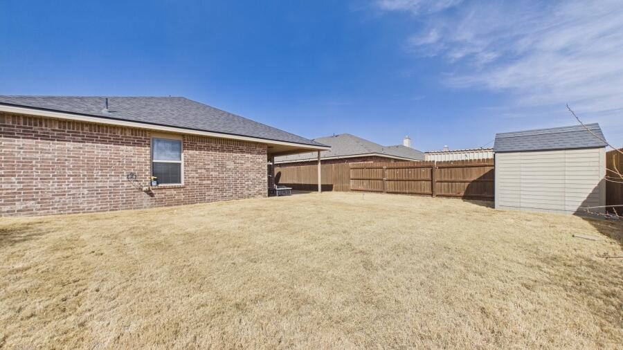3707 Rochester Avenue Lubbock, TX 79407 - Photo 40 of 40 a front view of a house with a yard
