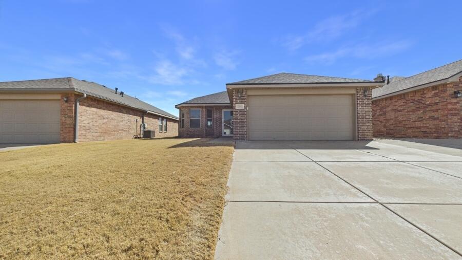 3707 Rochester Avenue Lubbock, TX 79407 - Photo 5 of 40 a view of garage and yard