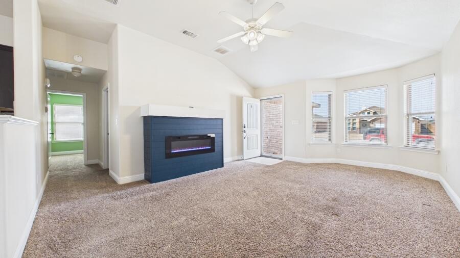 3707 Rochester Avenue Lubbock, TX 79407 - Photo 10 of 40 a view of empty room with a fireplace