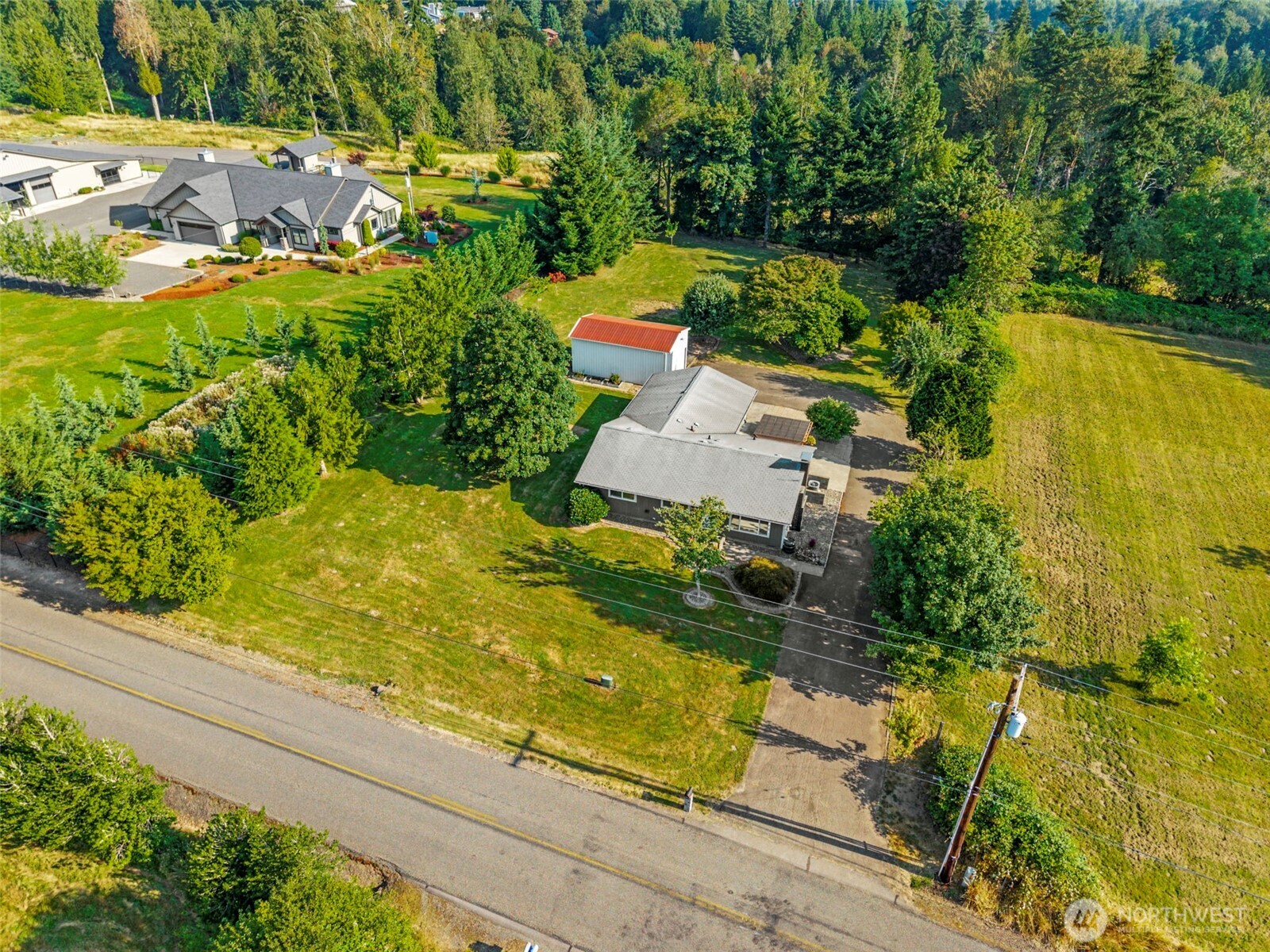 202 Waters Road Castle Rock, WA 98611 - Photo 19 of 38 an aerial view of residential house with swimming pool and lawn chairs