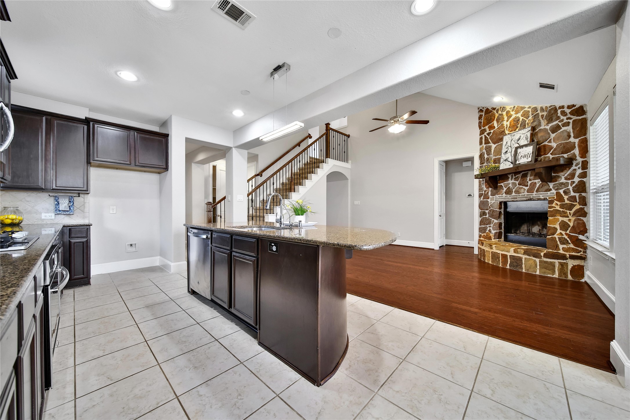 3910 Lupin Bush Lane Manvel, TX 77578 - Photo 15 of 30 a kitchen with stainless steel appliances granite countertop a refrigerator and a stove top oven