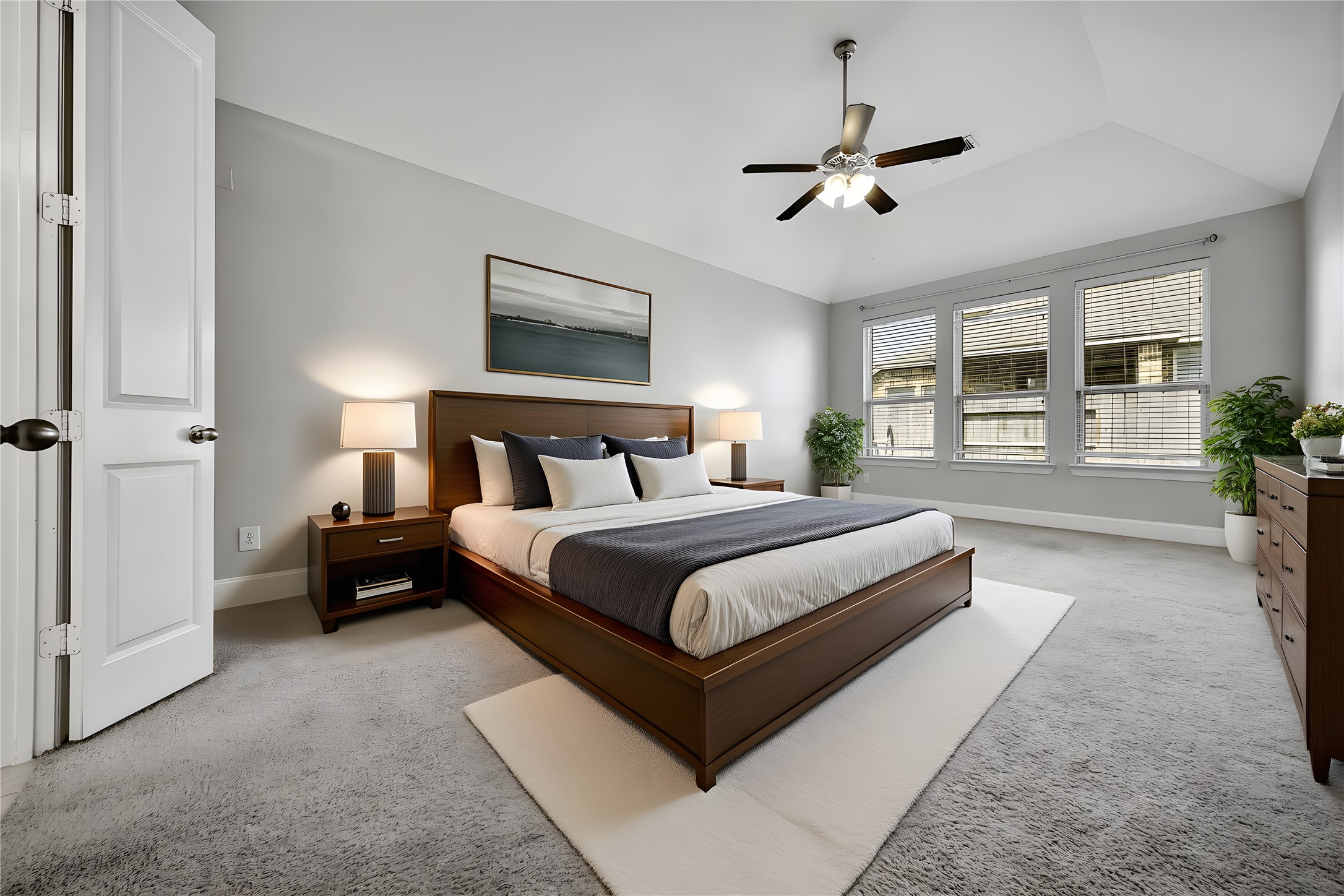 3910 Lupin Bush Lane Manvel, TX 77578 - Photo 6 of 30 a bedroom with a large bed and ceiling fan