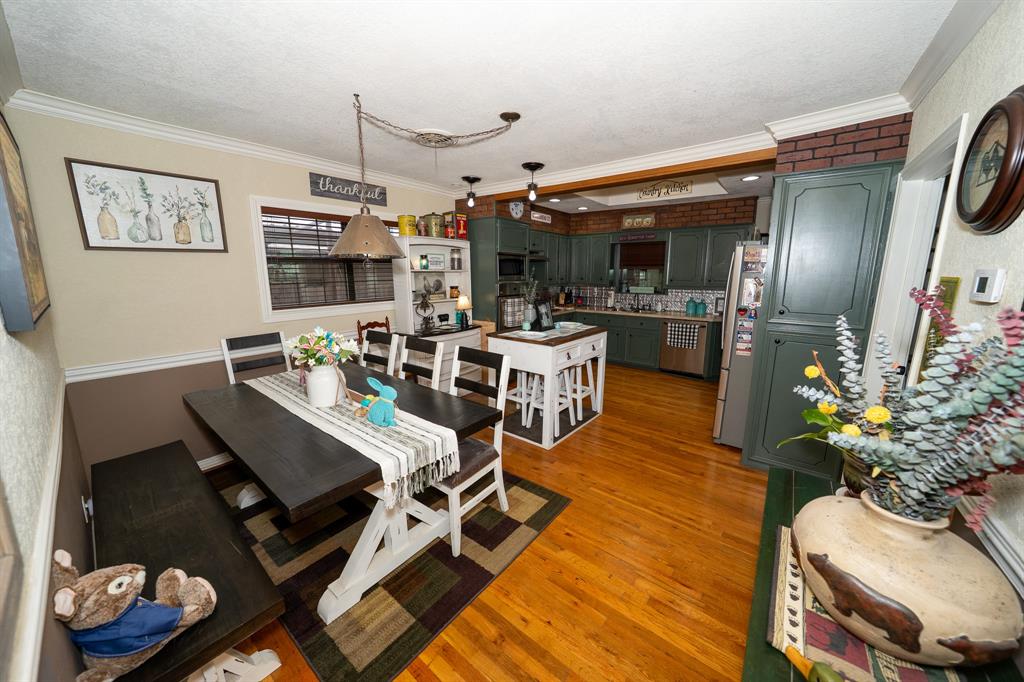 455 5th Street Hawley, TX 79525 - Photo 11 of 37 a living room with lots of furniture and kitchen view