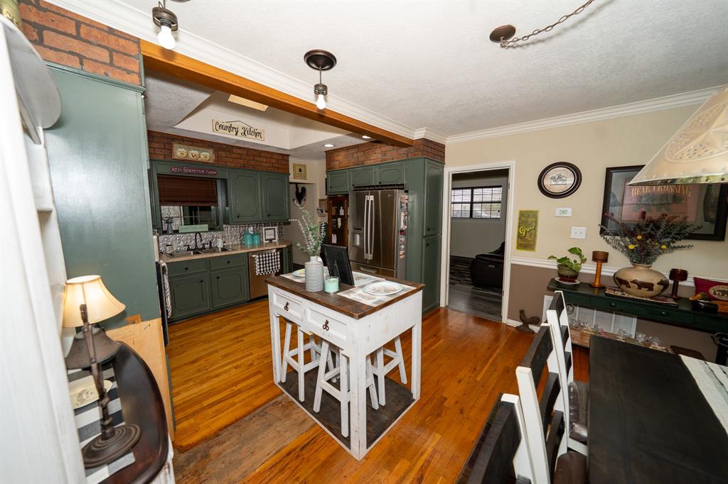 455 5th Street Hawley, TX 79525 - Photo 12 of 37 a view of a living room and kitchen