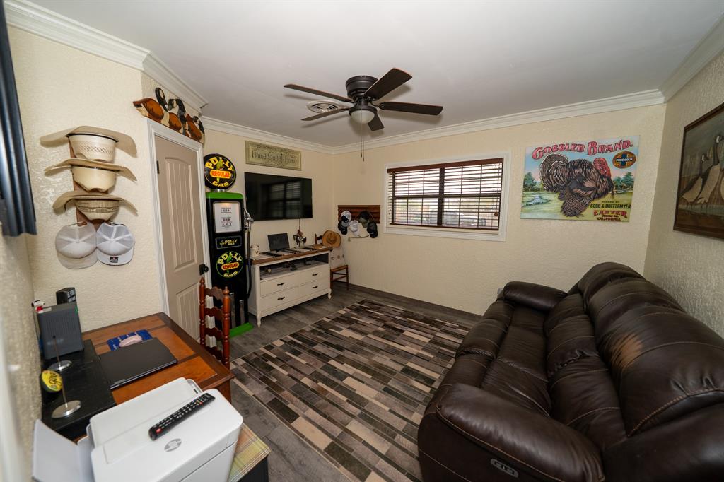 455 5th Street Hawley, TX 79525 - Photo 14 of 37 a living room with furniture and a flat screen tv