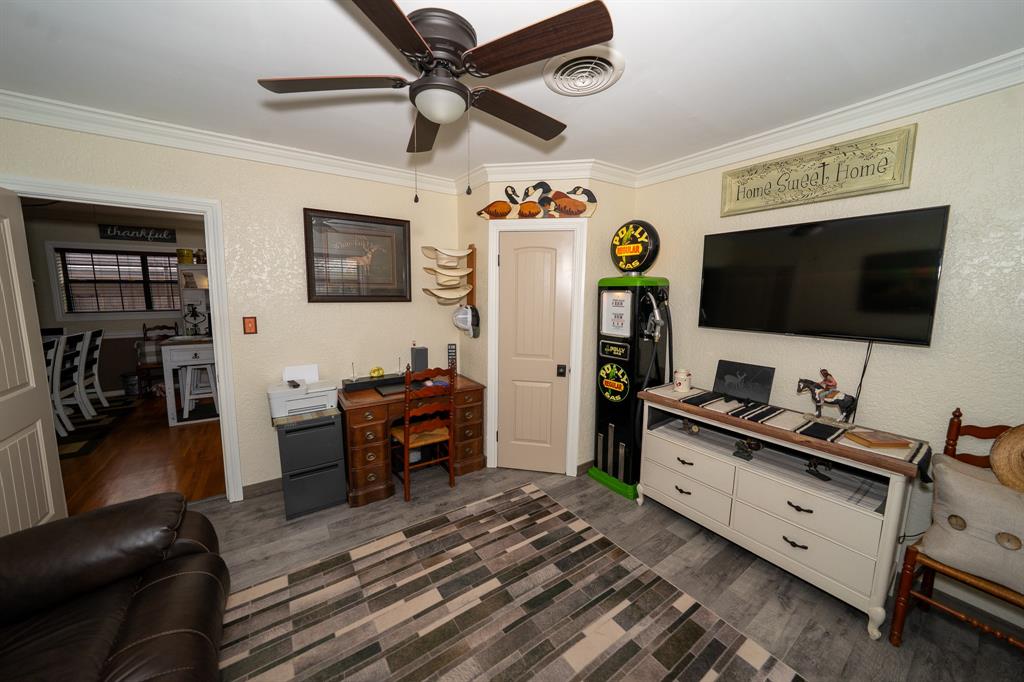 455 5th Street Hawley, TX 79525 - Photo 15 of 37 a living room with furniture and a flat screen tv