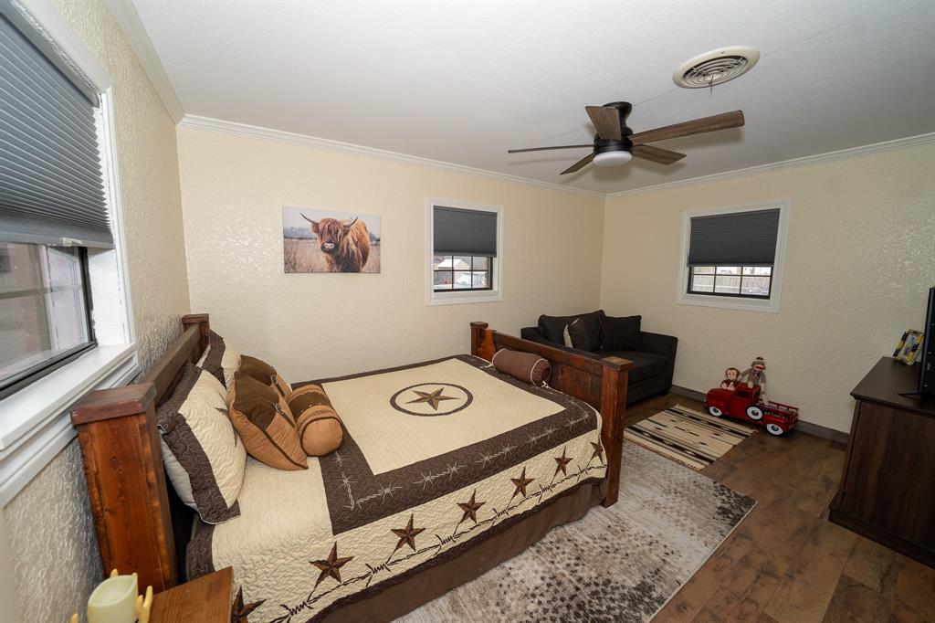 455 5th Street Hawley, TX 79525 - Photo 16 of 37 a bed room with a bed and a window