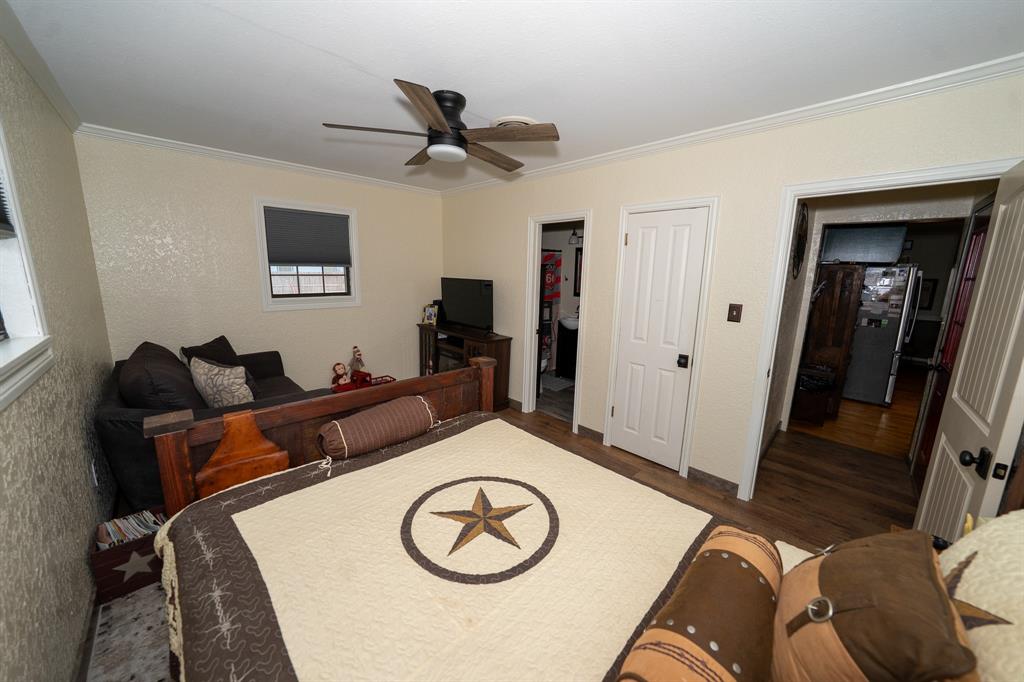 455 5th Street Hawley, TX 79525 - Photo 17 of 37 a living room with furniture and a wooden floor