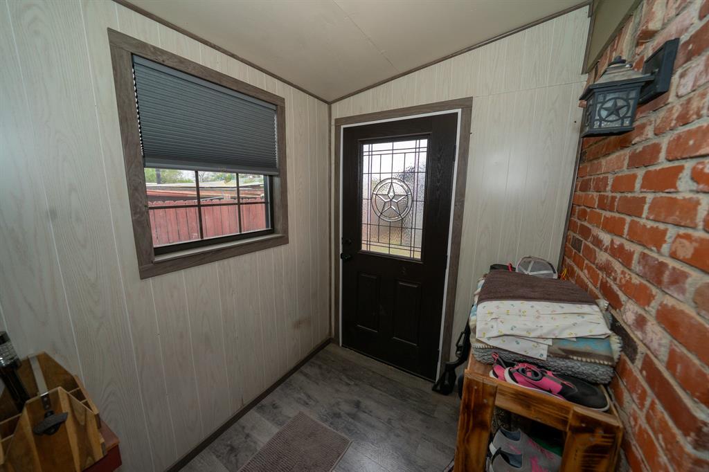 455 5th Street Hawley, TX 79525 - Photo 19 of 37 a room that has a bed and a chair in it