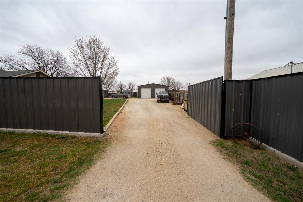 455 5th Street Hawley, TX 79525 - Photo 23 of 37 a view of a balcony with wooden fence