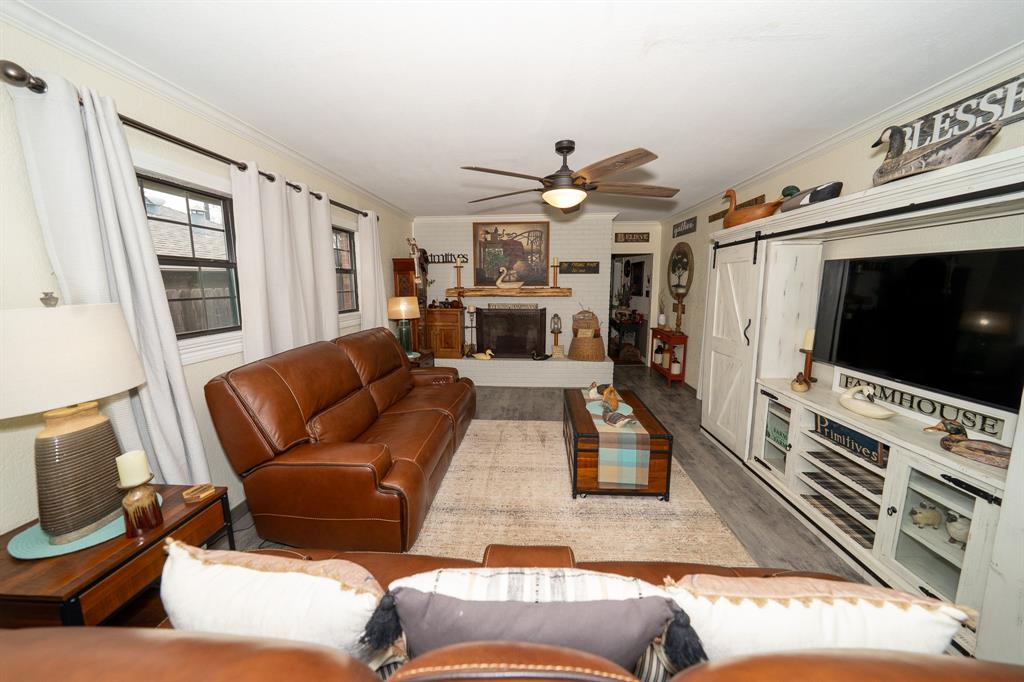 455 5th Street Hawley, TX 79525 - Photo 3 of 37 a living room with furniture and a flat screen tv