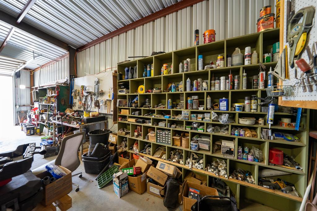 455 5th Street Hawley, TX 79525 - Photo 36 of 37 a view of walk in closet with clothes and shoes