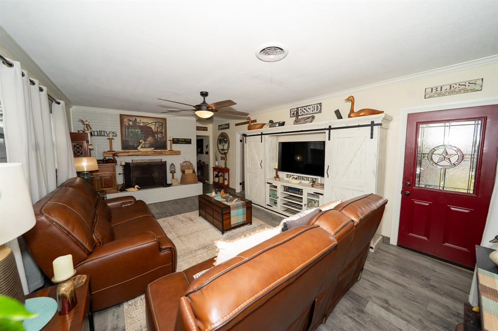 455 5th Street Hawley, TX 79525 - Photo 5 of 37 a living room with furniture kitchen view and a flat screen tv