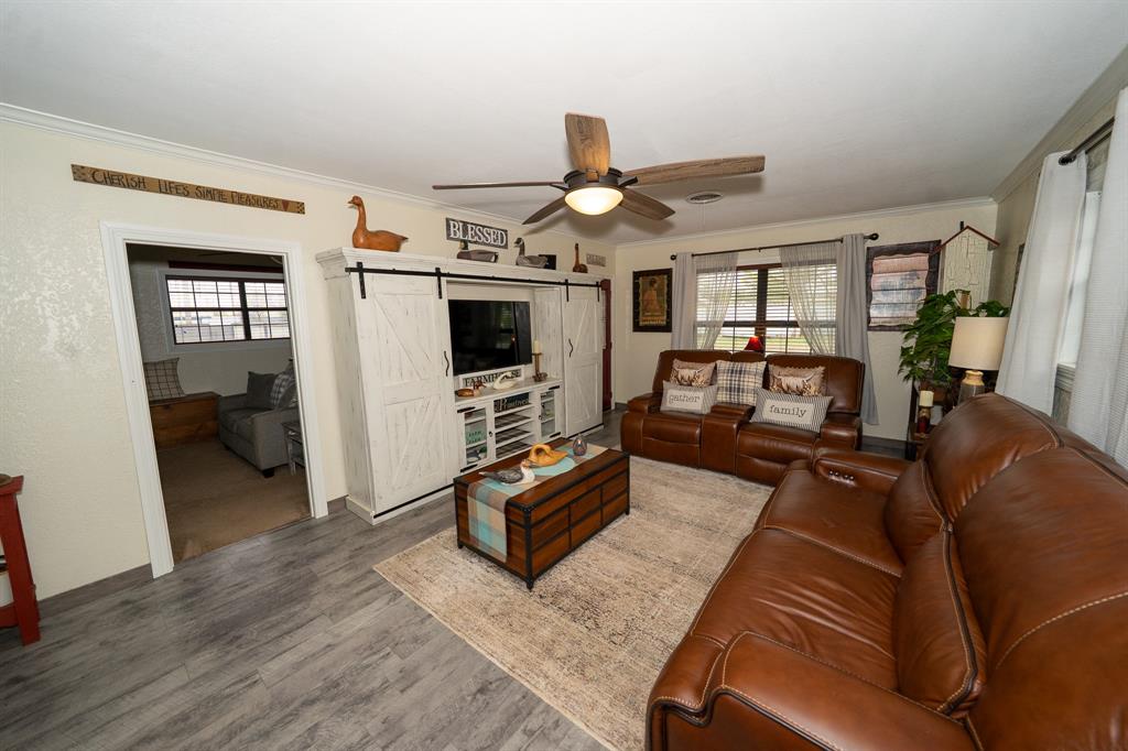 455 5th Street Hawley, TX 79525 - Photo 6 of 37 a living room with furniture and a flat screen tv
