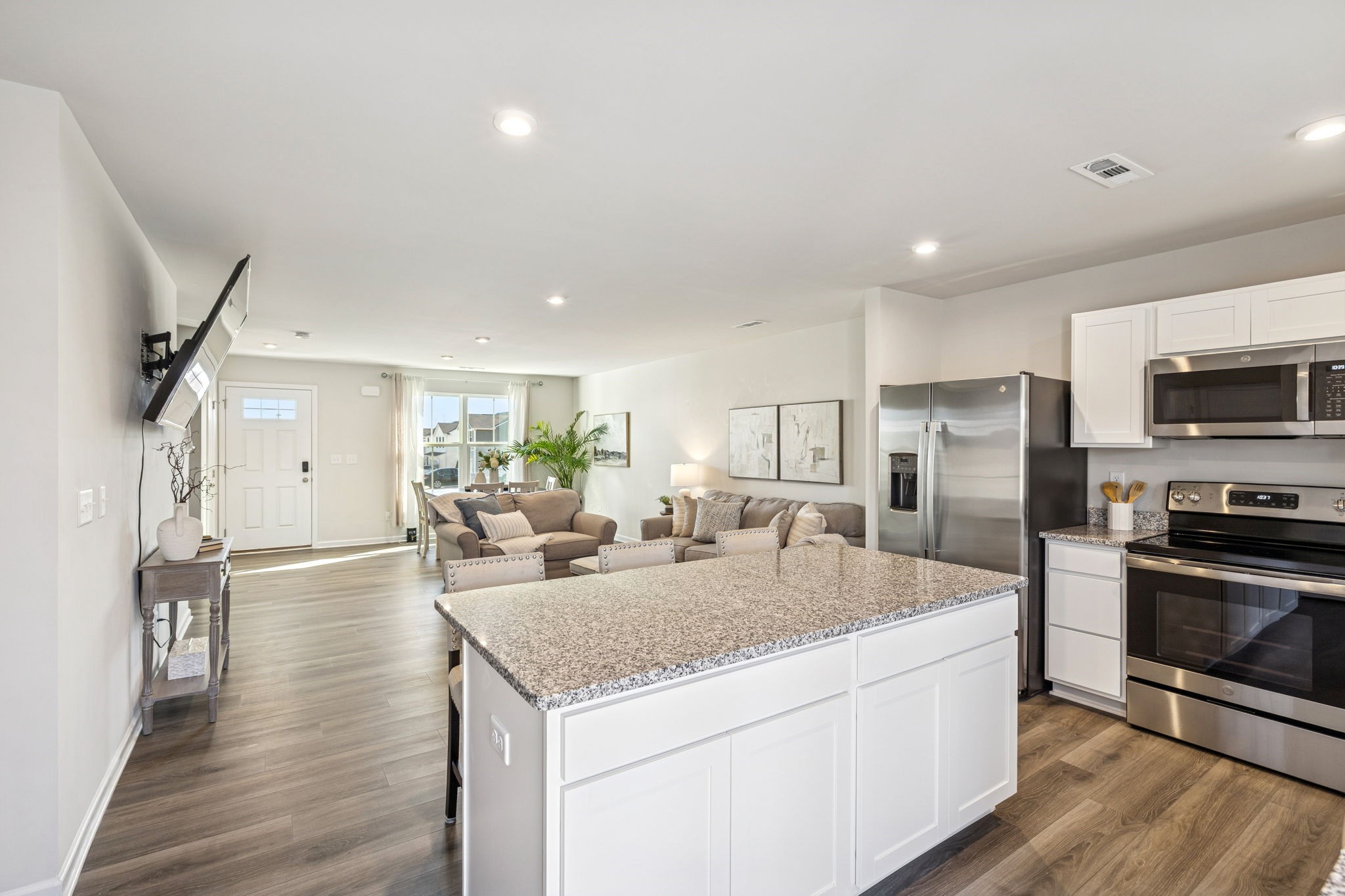 2116 Somersby Trail Spring Hill, TN 37174 - Photo 15 of 45 a kitchen with stainless steel appliances granite countertop a sink stove and refrigerator
