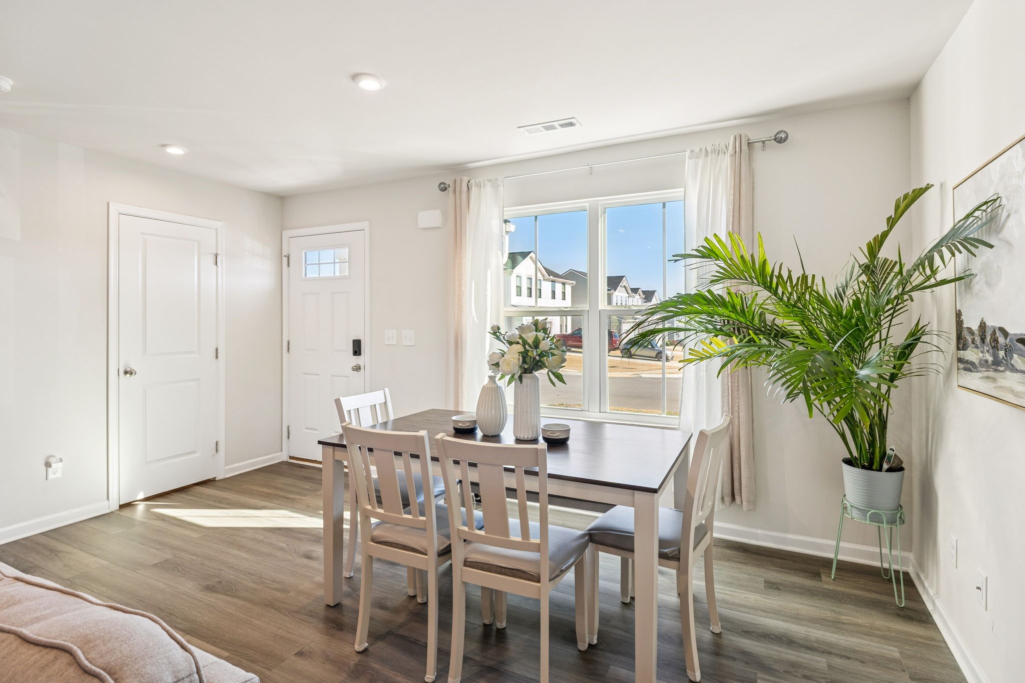 2116 Somersby Trail Spring Hill, TN 37174 - Photo 18 of 45 a view of a dining room with furniture and a potted plant