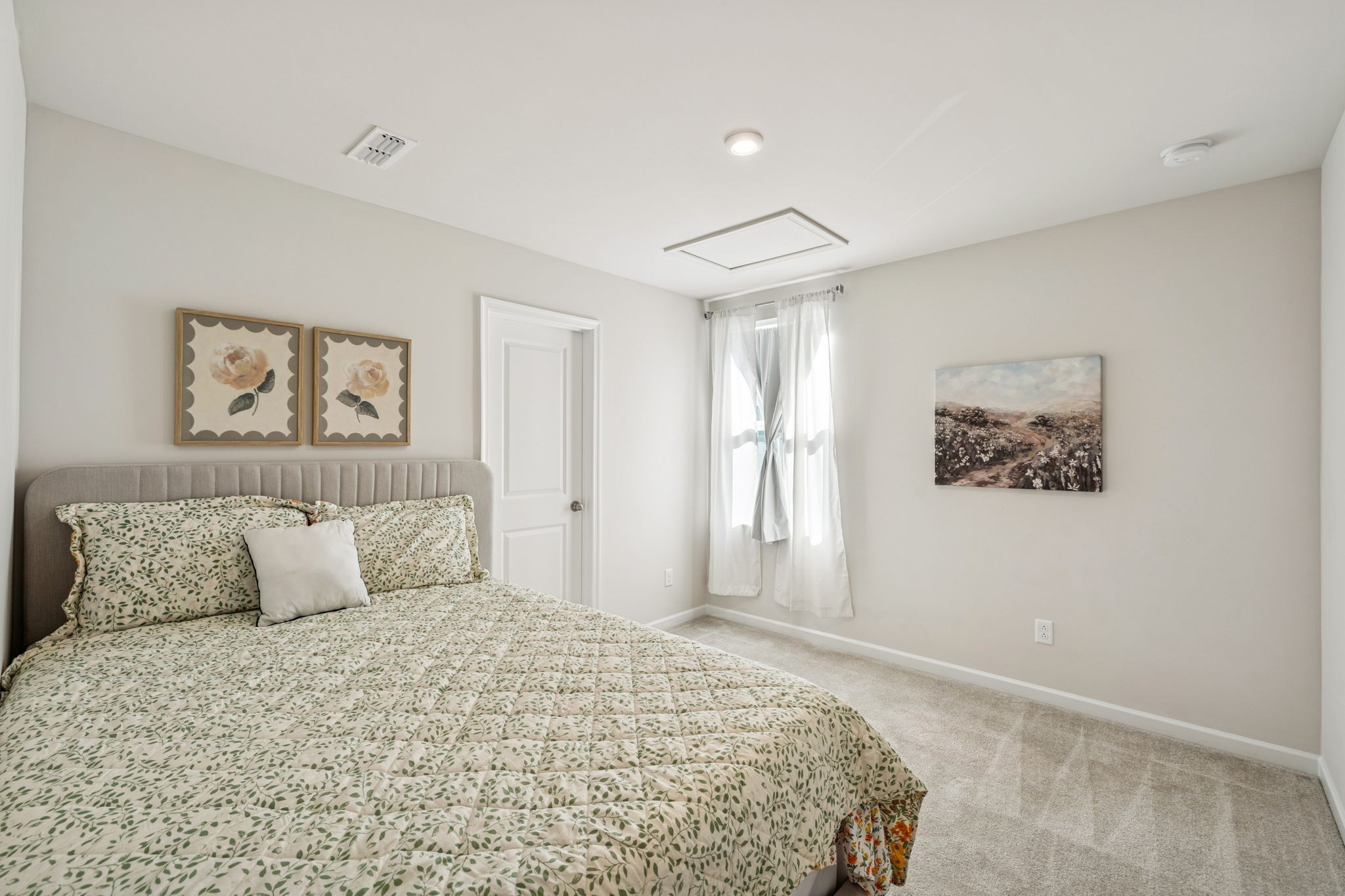 2116 Somersby Trail Spring Hill, TN 37174 - Photo 27 of 45 a bedroom with a large bed and a painting on the wall