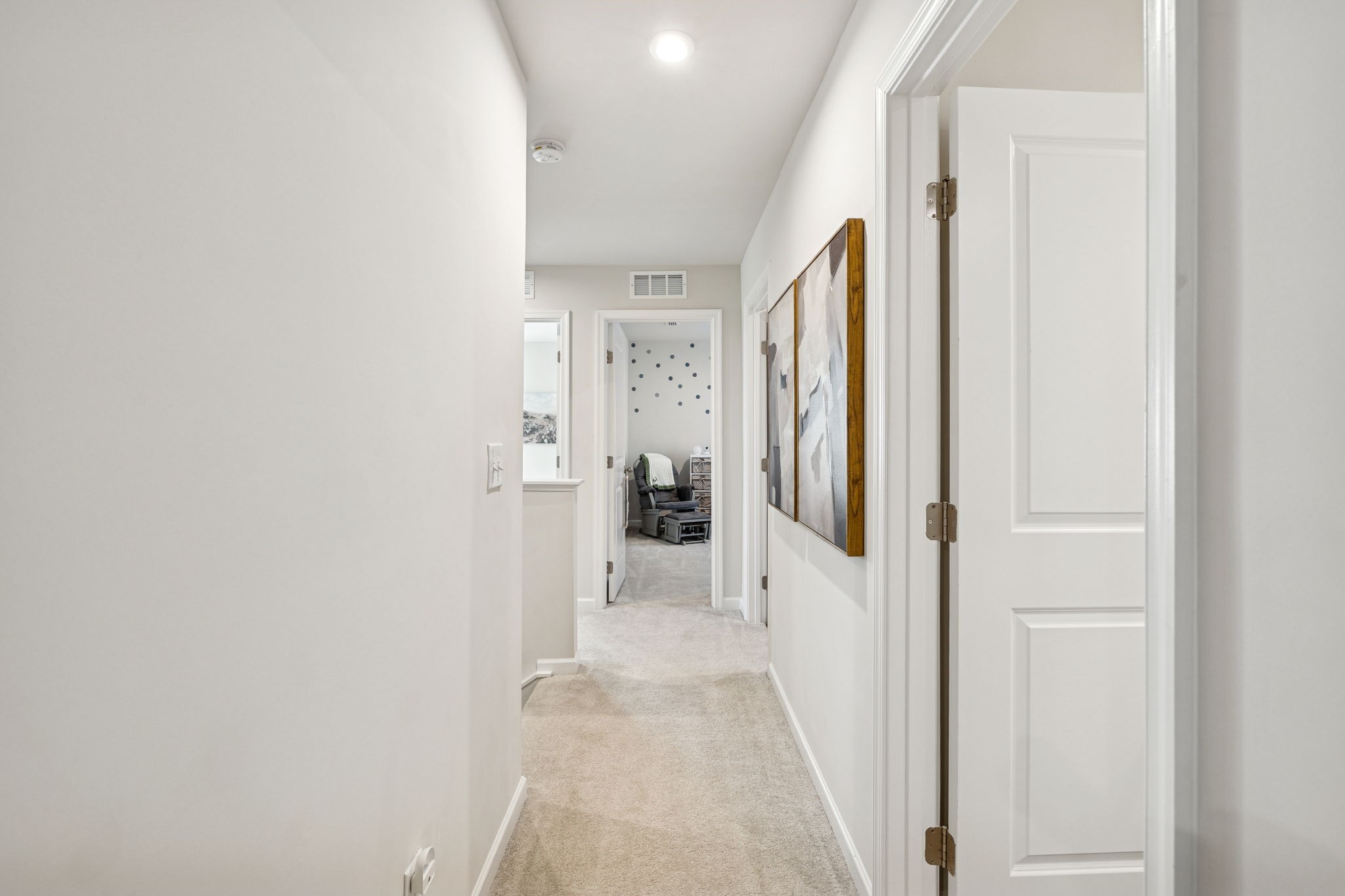 2116 Somersby Trail Spring Hill, TN 37174 - Photo 32 of 45 a view of a hallway with a white walls and stairs