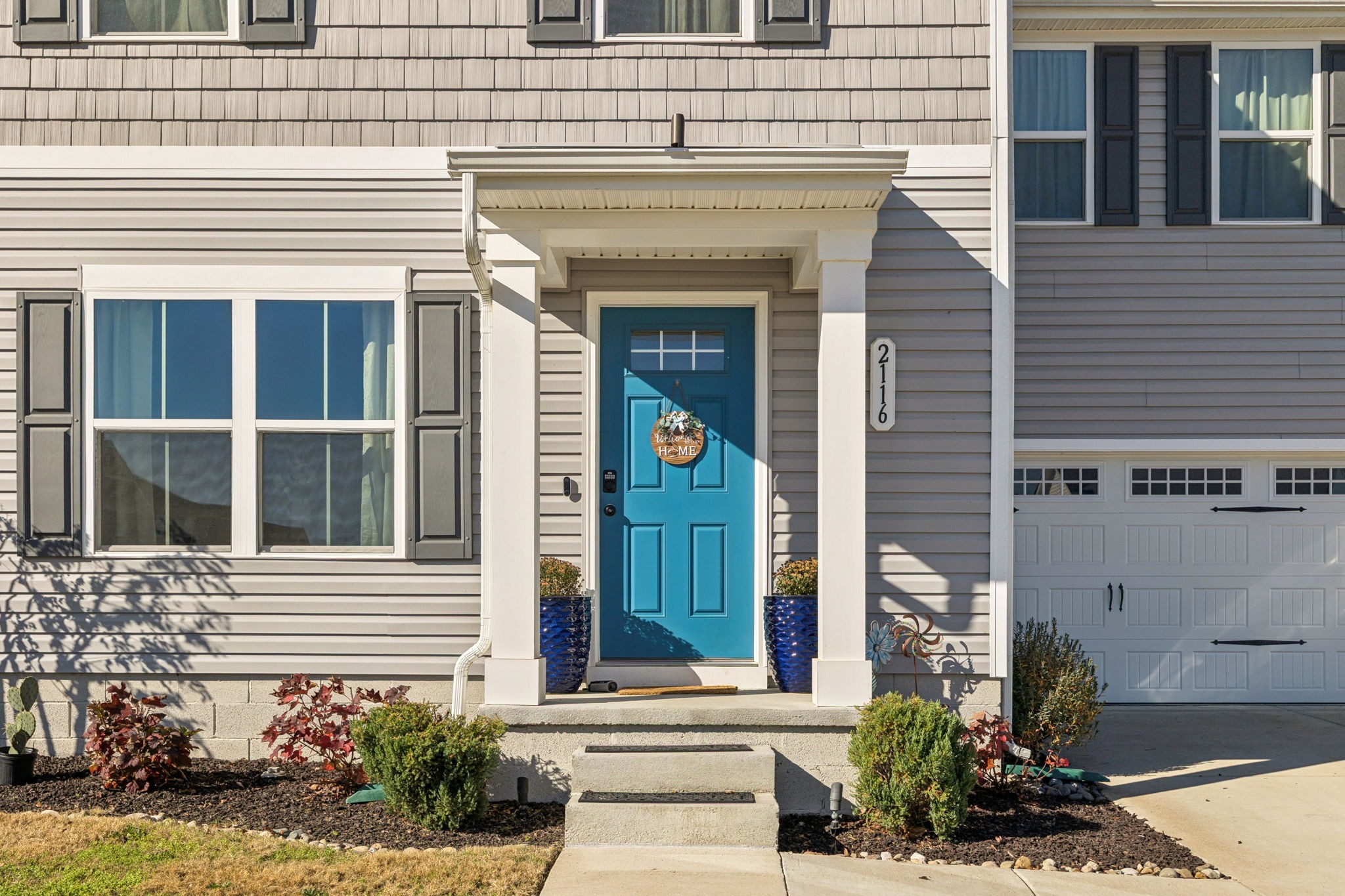 2116 Somersby Trail Spring Hill, TN 37174 - Photo 4 of 45 a front view of a house with a garden