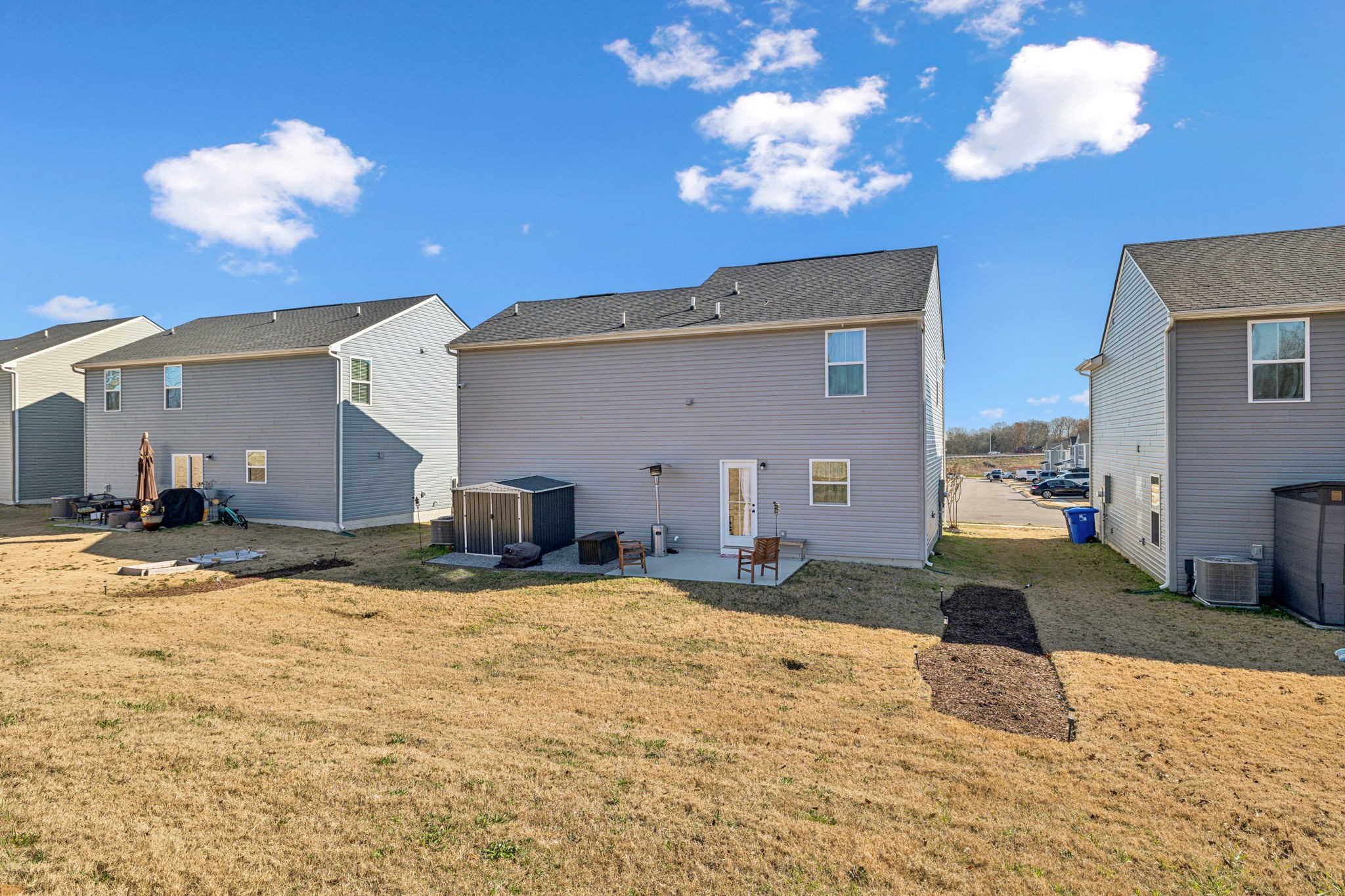 2116 Somersby Trail Spring Hill, TN 37174 - Photo 41 of 45 a view of a livingroom with kitchen furniture and a chandelier