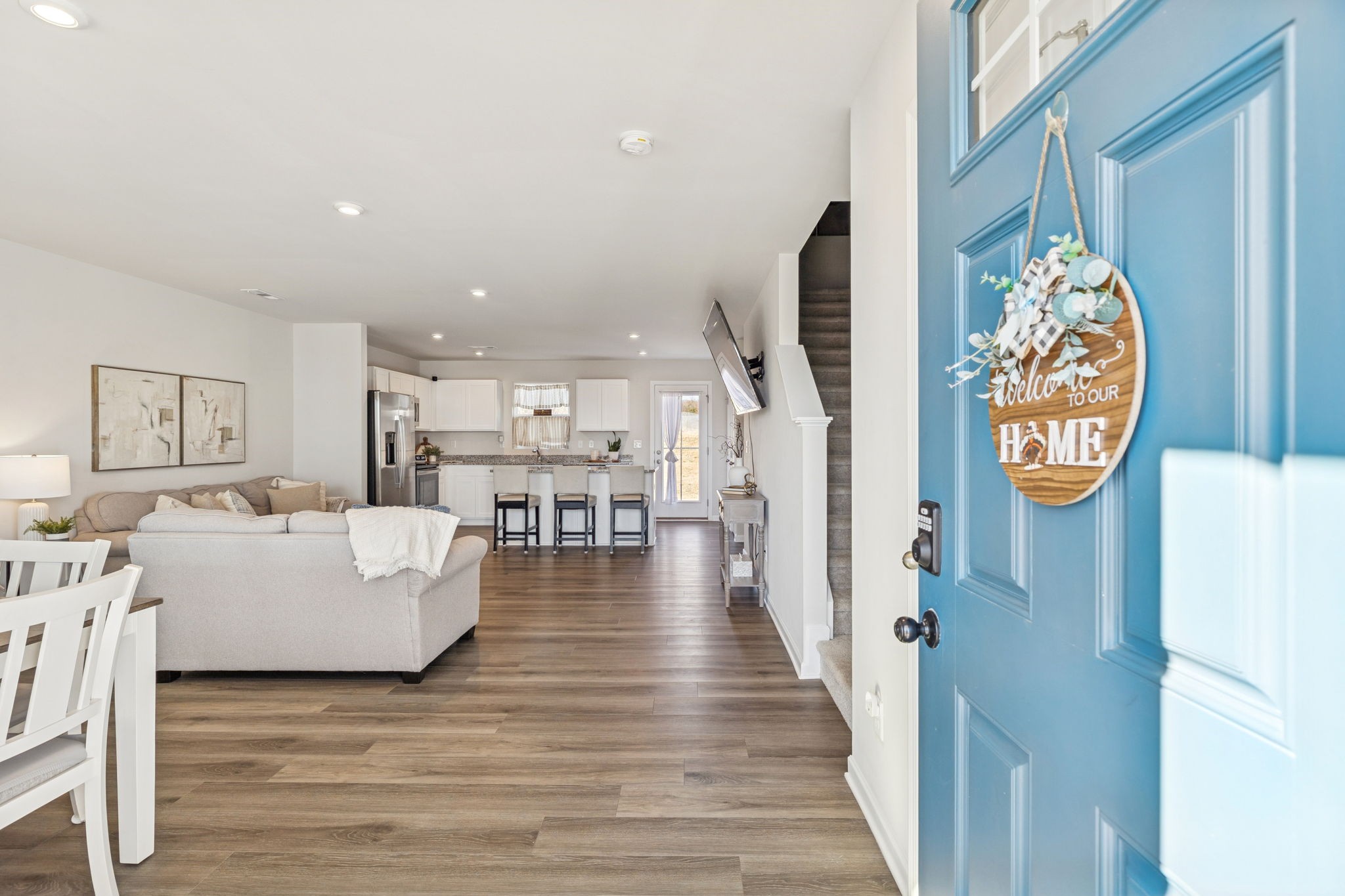 2116 Somersby Trail Spring Hill, TN 37174 - Photo 5 of 45 a living room with fireplace furniture and a wooden floor