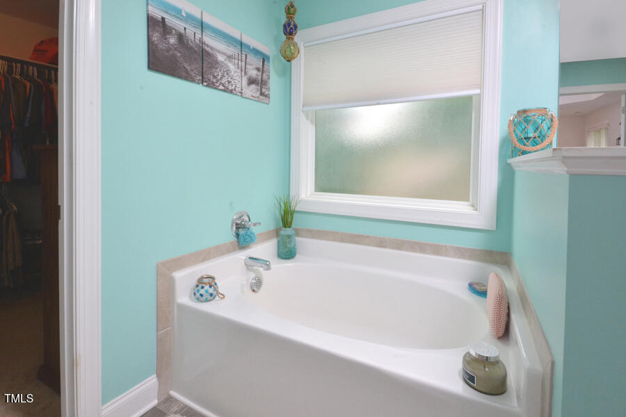 195 Timberwind Road Franklinton, NC 27525 - Photo 25 of 28 a white bath tub sitting in a bathroom