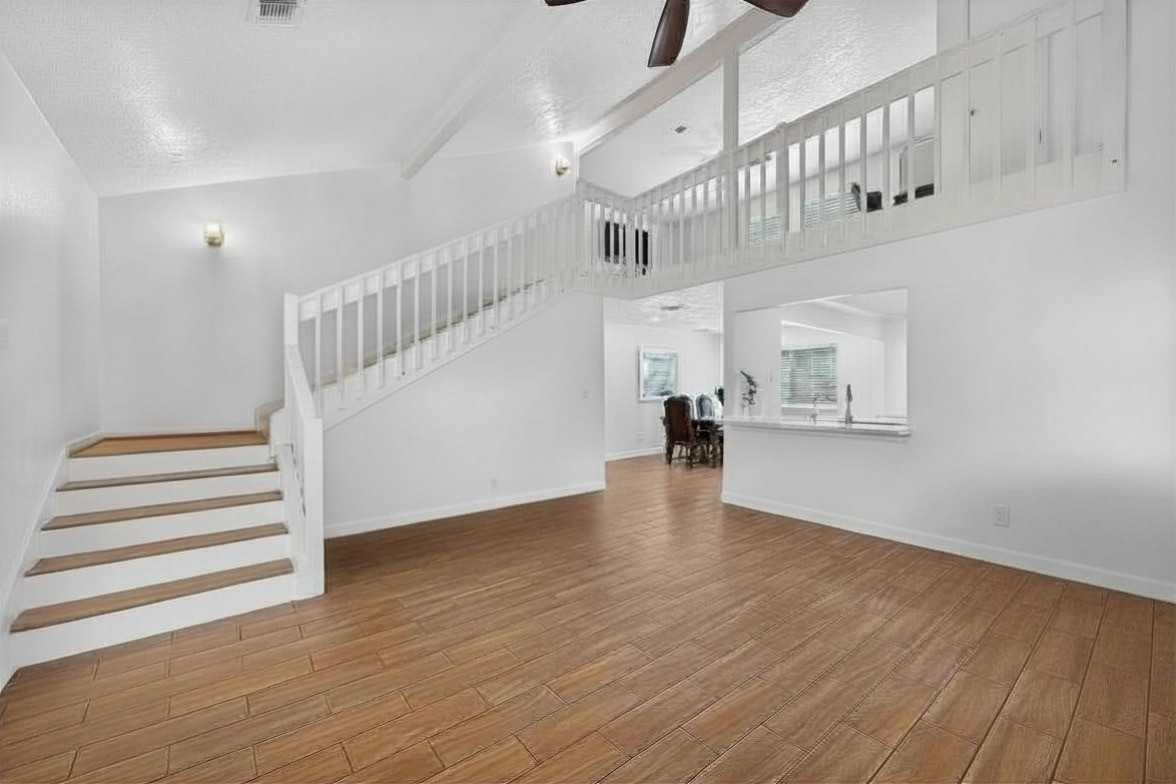 5323 Windsong Trail Houston, TX 77084 - Photo 2 of 30 Virtually removed furnitire. Nice wide staircase leads you upstairs.
