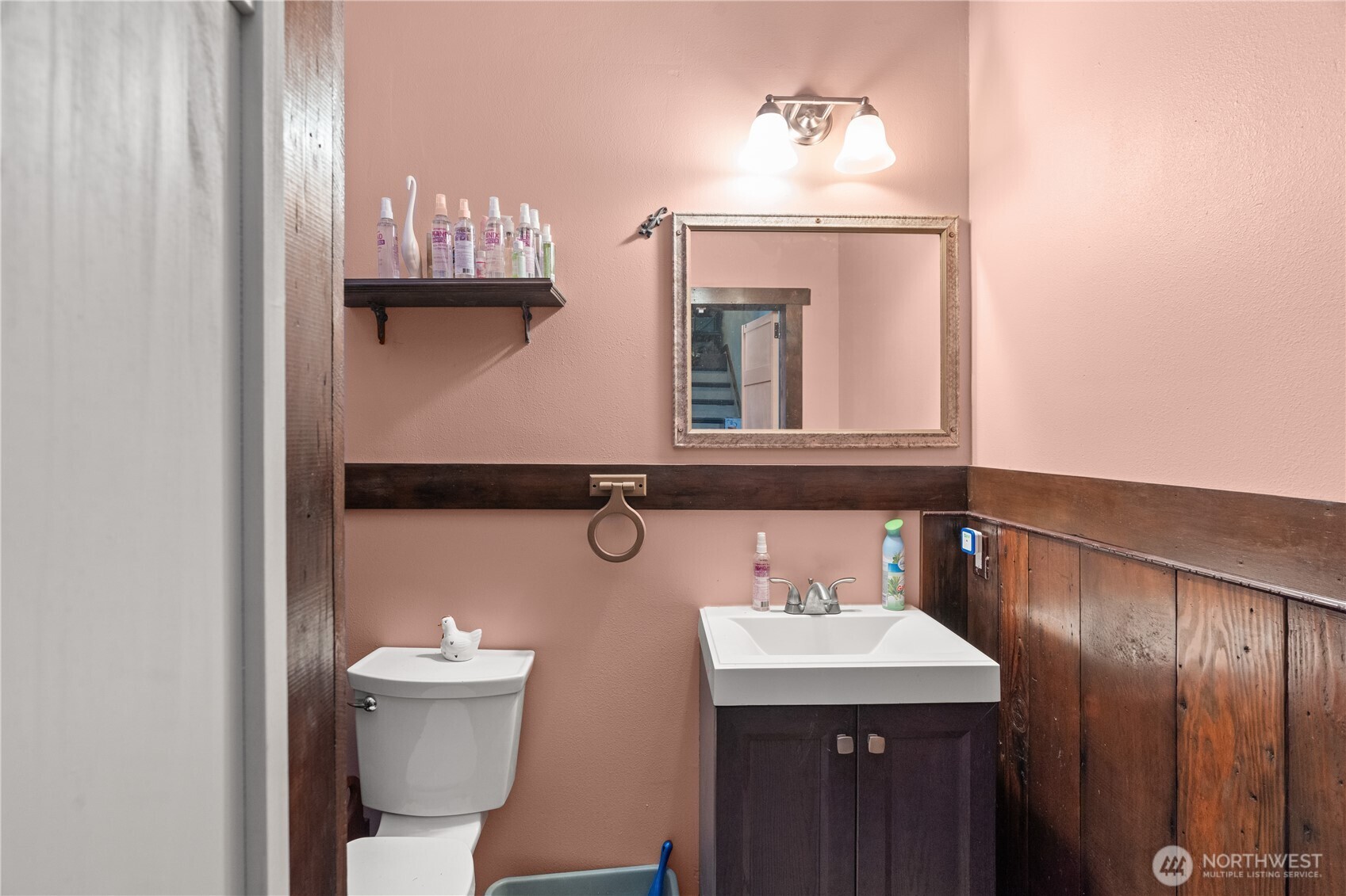 219 East Curtis Street Aberdeen, WA 98520 - Photo 15 of 29 a bathroom with a toilet sink and mirror