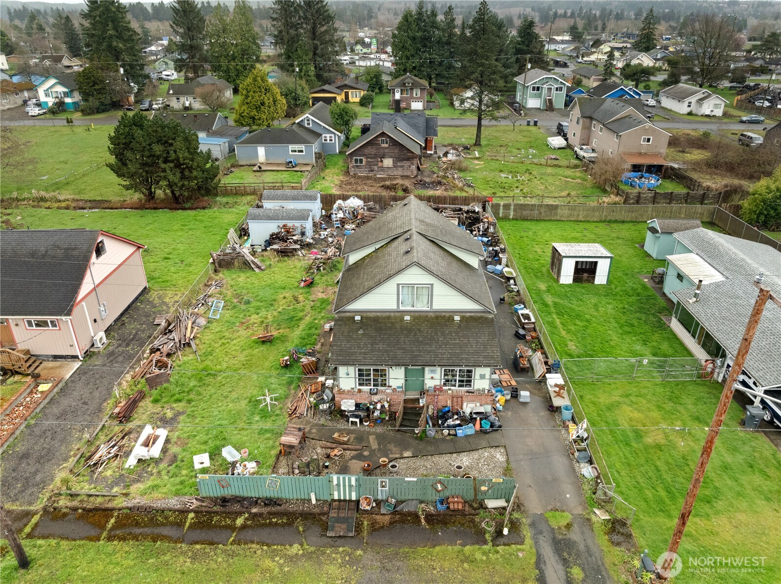 219 East Curtis Street Aberdeen, WA 98520 - Photo 25 of 29 an aerial view of a house with a garden and lake view