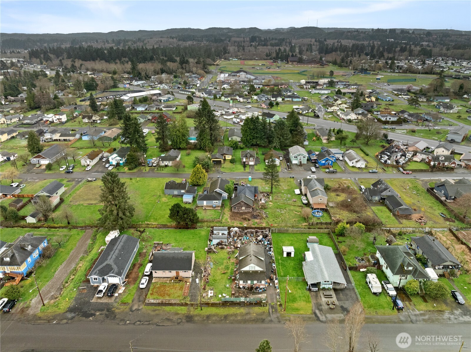 219 East Curtis Street Aberdeen, WA 98520 - Photo 26 of 29 an aerial view of residential houses with outdoor space