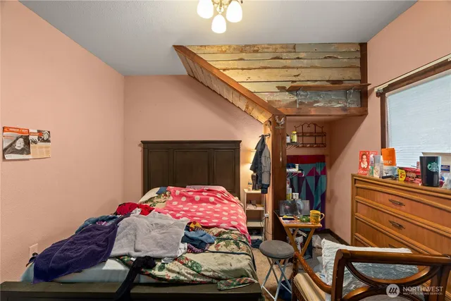 a bedroom with furniture and a bed