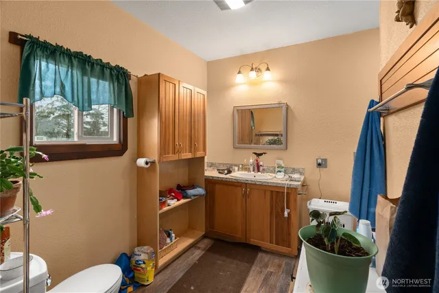 a bathroom with a sink toilet and tub