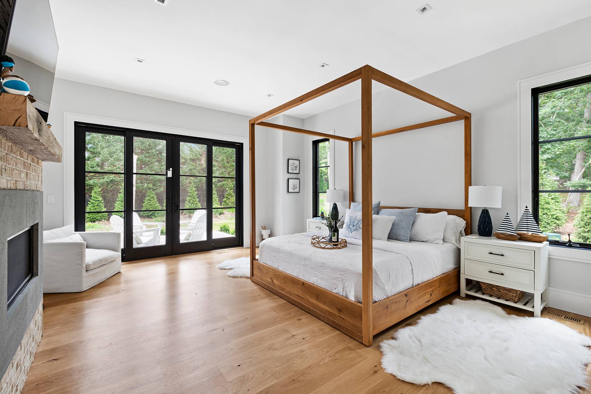 8 Crows Nest Lane East Hampton, NY 11937 - Photo 11 of 33 a bedroom with a bed and a large window