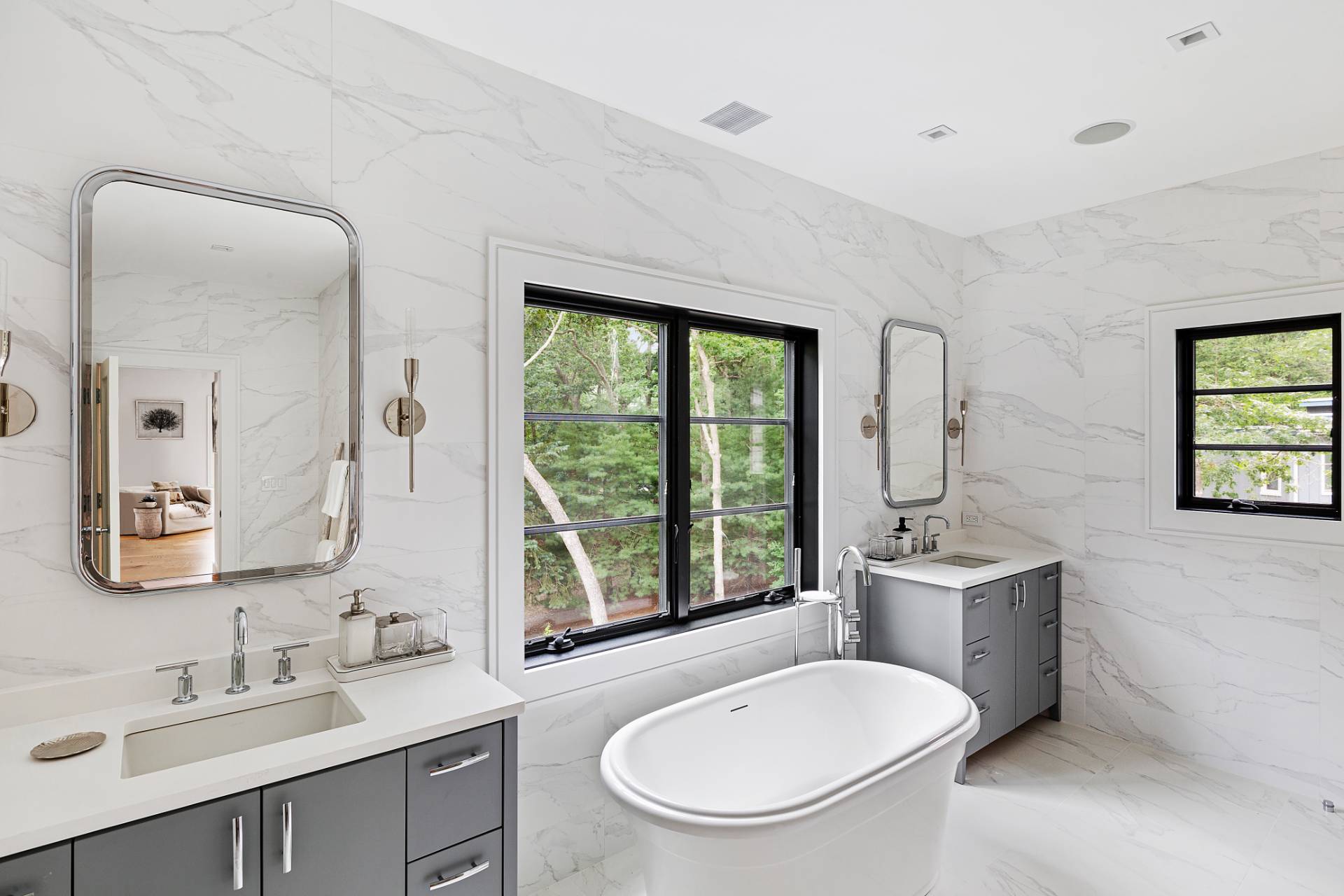 8 Crows Nest Lane East Hampton, NY 11937 - Photo 18 of 33 a bathroom with a toilet a sink and a mirror