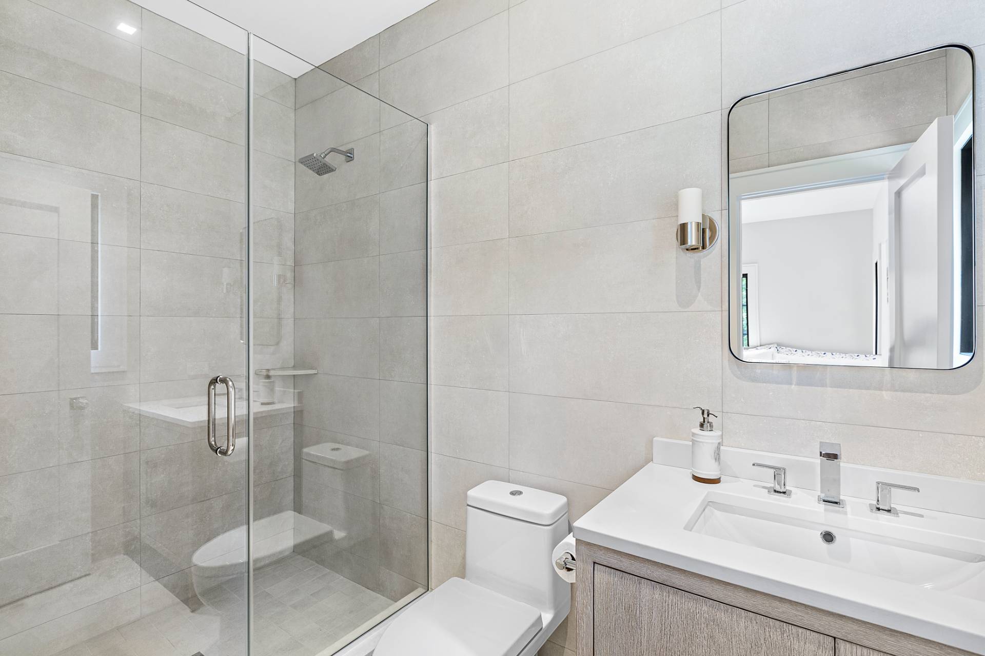 8 Crows Nest Lane East Hampton, NY 11937 - Photo 20 of 33 a bathroom with a sink a toilet and shower