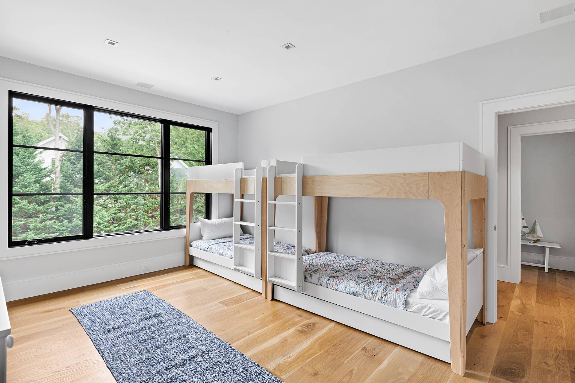 8 Crows Nest Lane East Hampton, NY 11937 - Photo 23 of 33 a living room with furniture and a rug