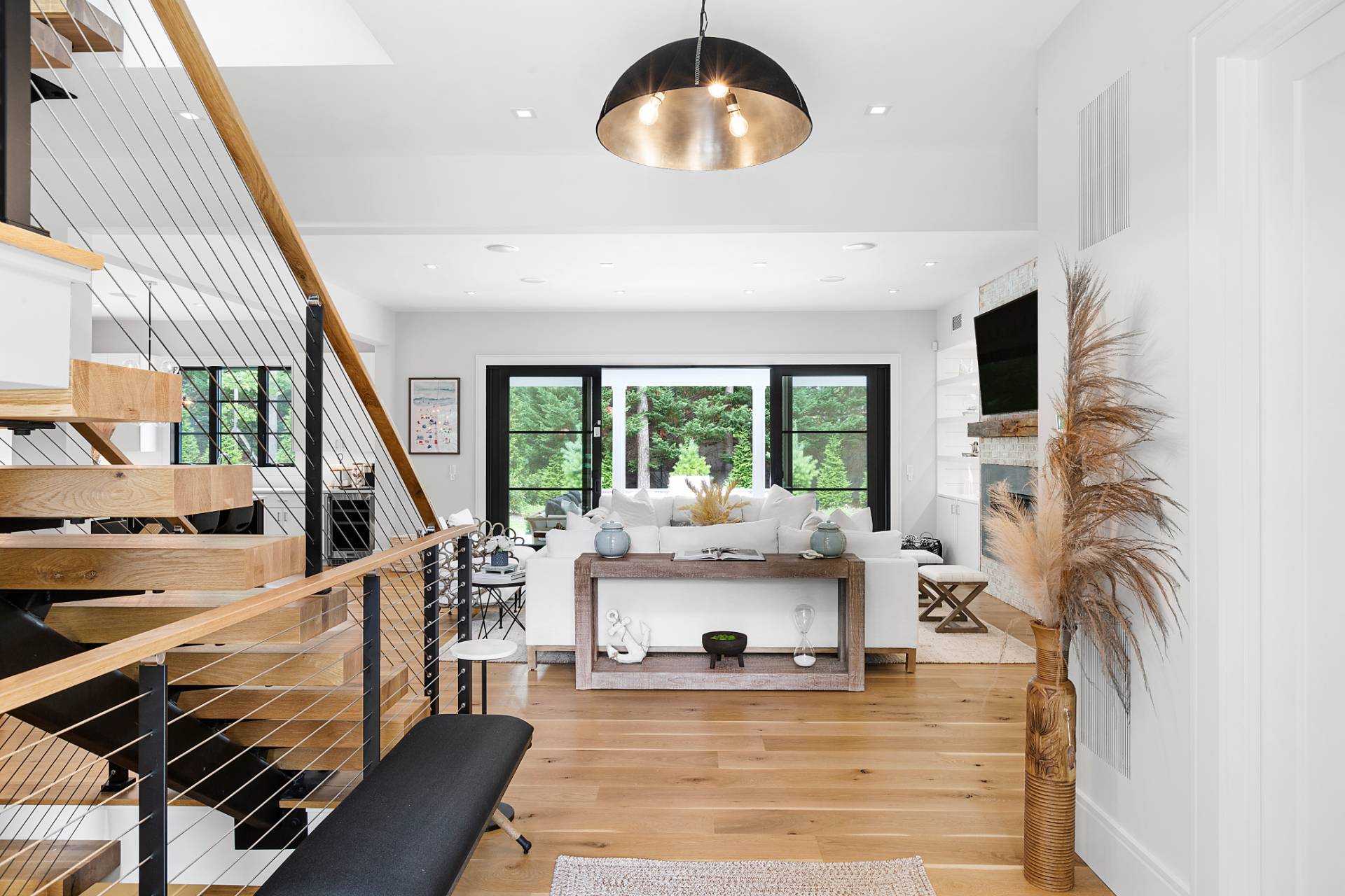 8 Crows Nest Lane East Hampton, NY 11937 - Photo 4 of 33 a living room with fireplace furniture and a large window