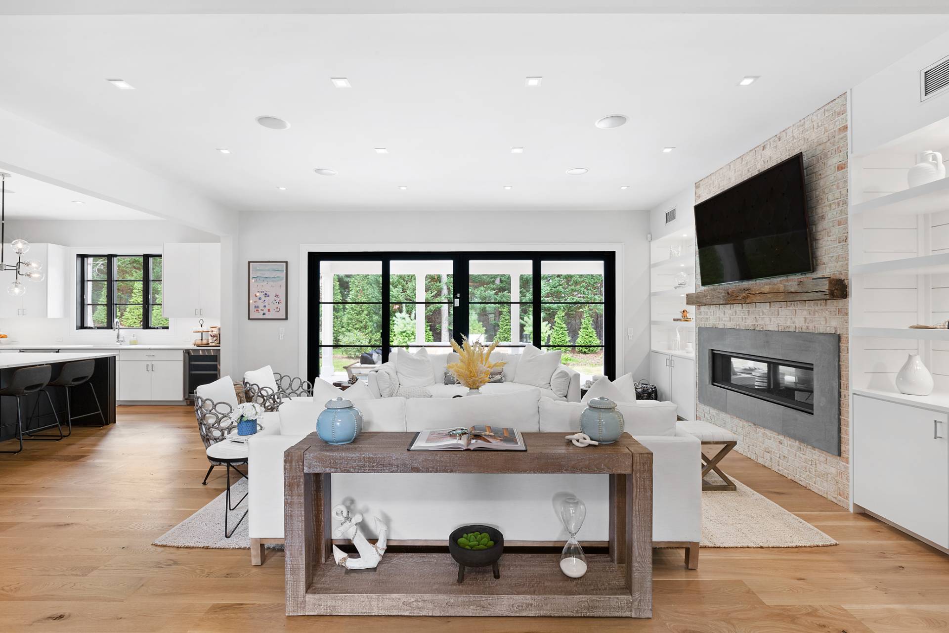 8 Crows Nest Lane East Hampton, NY 11937 - Photo 6 of 33 a living room with fireplace furniture and a flat screen tv