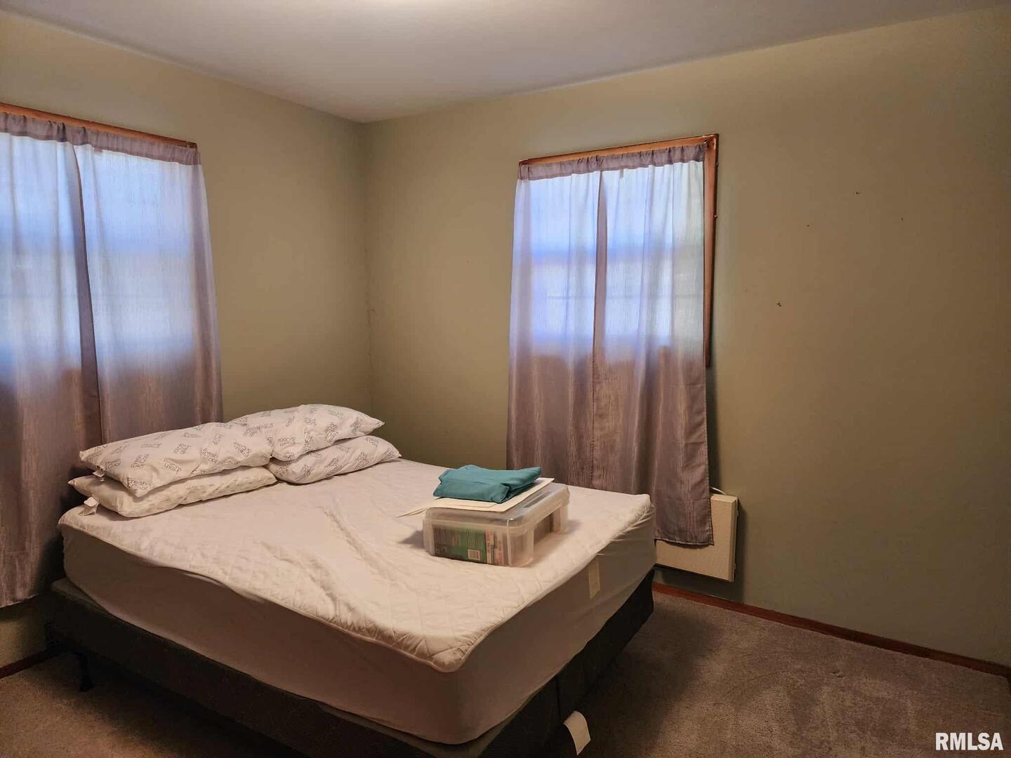 708 South Broadway Street Sesser, IL 62884 - Photo 11 of 15 a bedroom with a bed and wooden floor