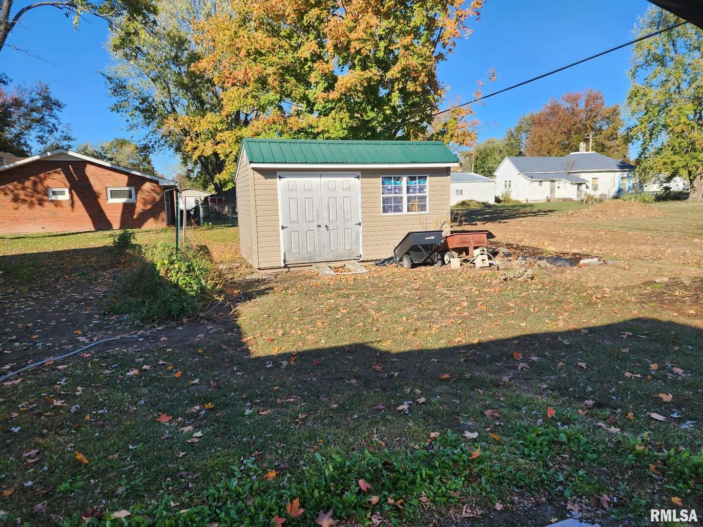 708 South Broadway Street Sesser, IL 62884 - Photo 4 of 15 a view of a house with backyard and tree