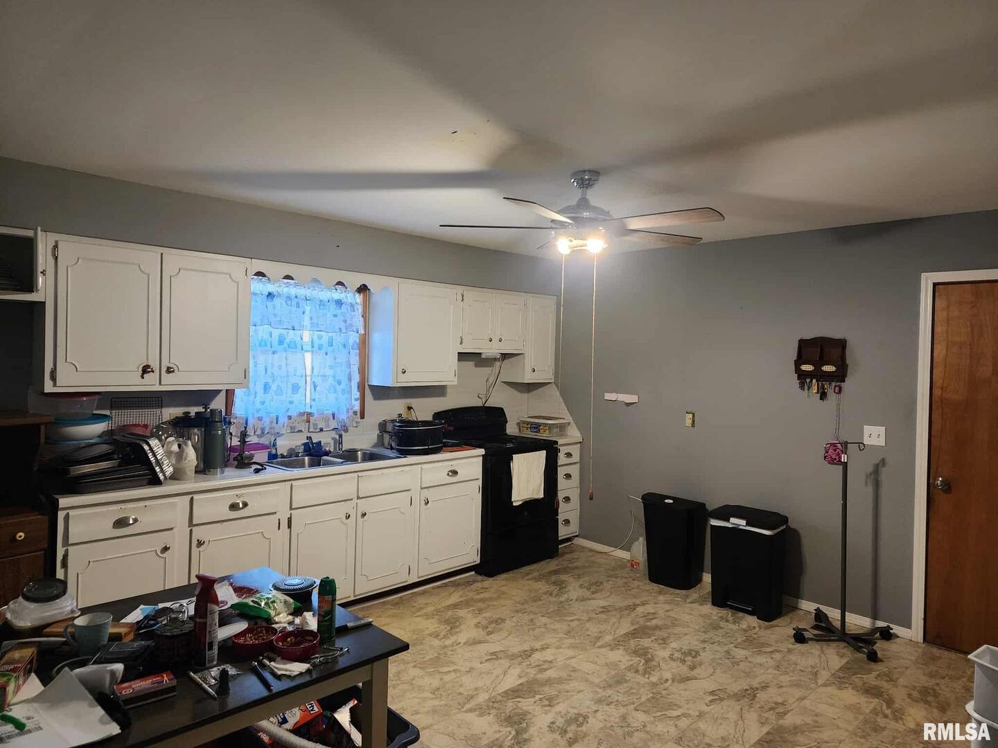 708 South Broadway Street Sesser, IL 62884 - Photo 7 of 15 a kitchen with stainless steel appliances a sink stove and cabinets