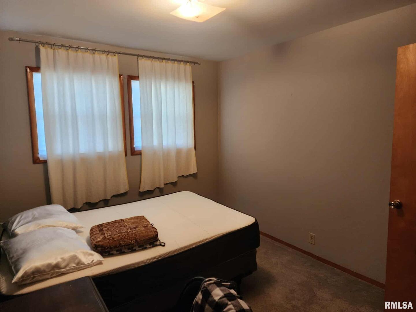 708 South Broadway Street Sesser, IL 62884 - Photo 9 of 15 a bedroom with a bed and a window